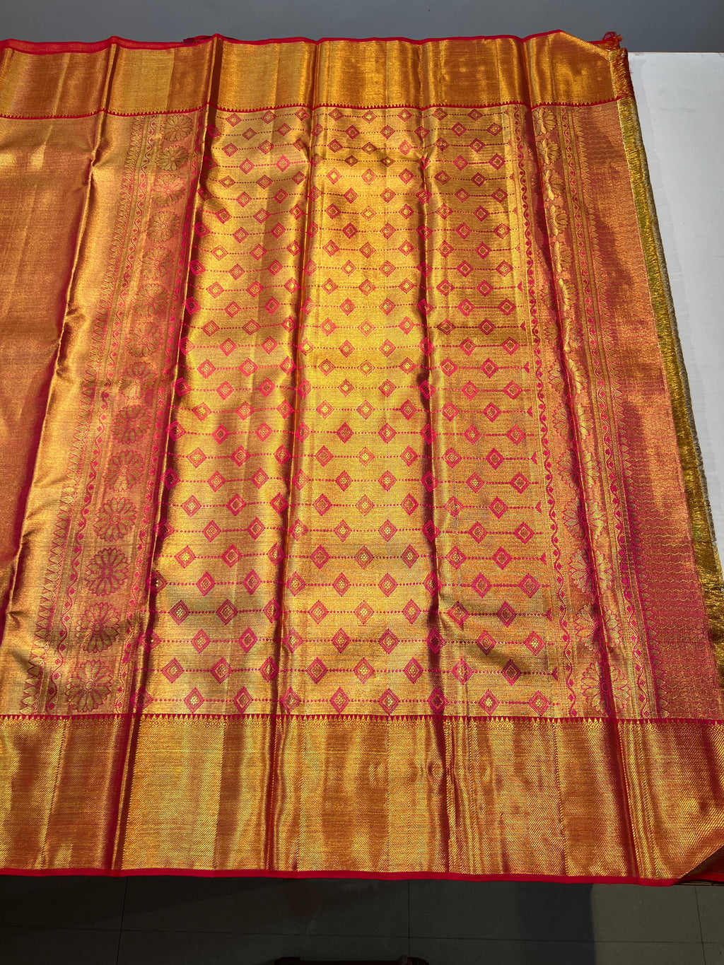 Pure Kanchipuram Handloom Gold Tissue Silk Saree with Pink Salvage.