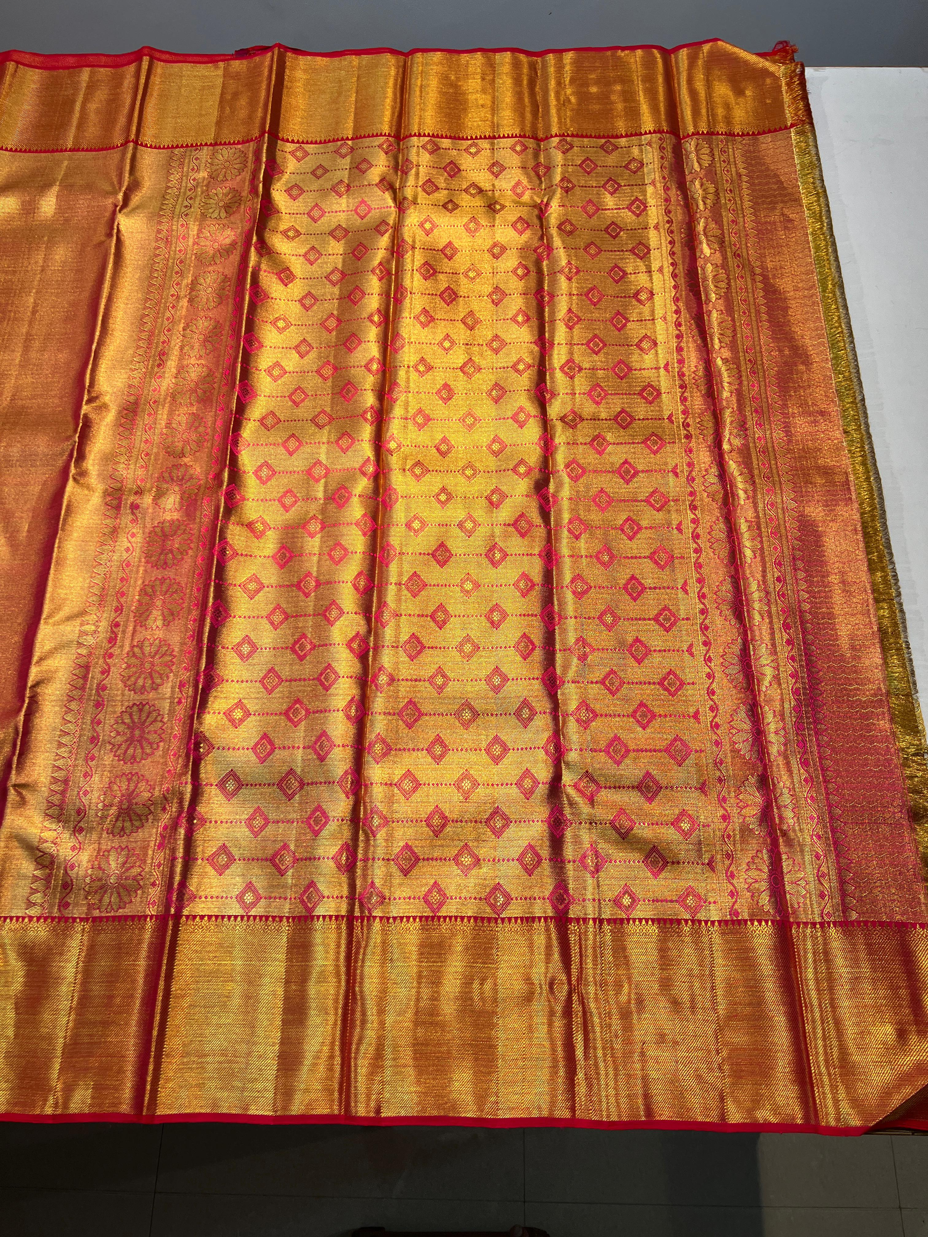 Pure Kanchipuram Handloom Gold Tissue Silk Saree with Pink Salvage.