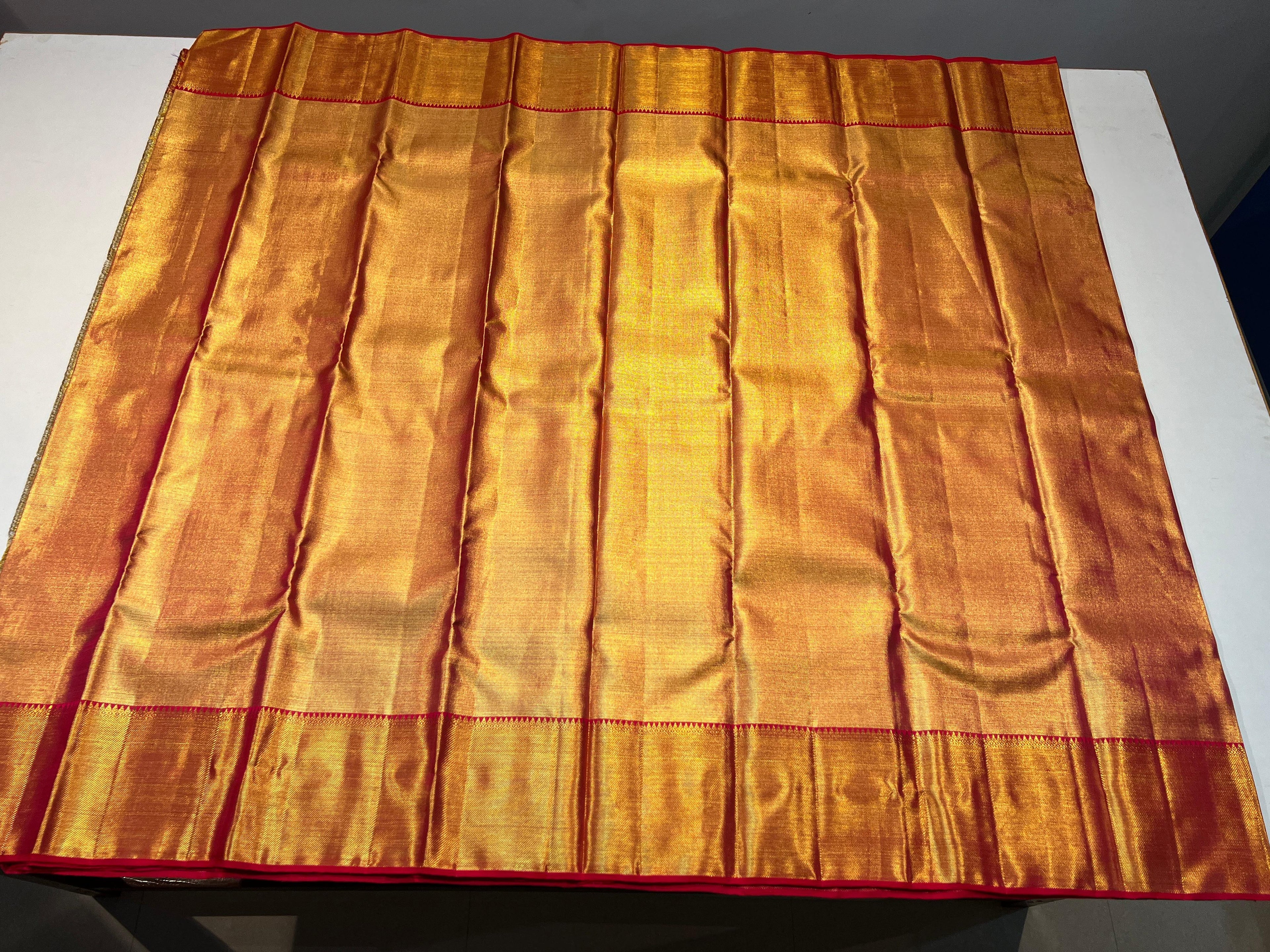 Pure Kanchipuram Handloom Gold Tissue Silk Saree with Pink Salvage.